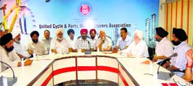 Members of the United Cycle and Parts Association at a meeting in Ludhiana on Thursday