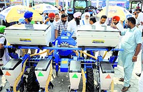 Visitors have a look at farming machines on the PAU campus
