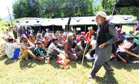 Flood victims at an Army medical camp in Kotranka tehsil of Rajouri district on Saturday