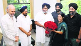 Punjab Deputy CM Sukhbir Badal along with other Akali leaders greets Union Minister Sushma Swaraj in New Delhi on Saturday
