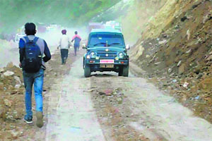 Vehicles ply on the Jammu-Srinagar National Highway on Tuesday.   