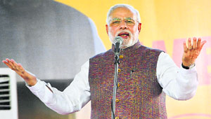 Prime Minister Narendra Modi addresses a gathering in Ahmedabad on Tuesday.