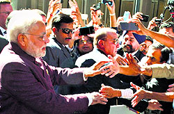 Prime Minister Narendra Modi being greeted by people outside his hotel in New York on Friday