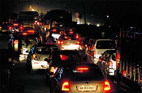 Vehicles stuck in a snarl-up due to the ongoing recarpeting of road on the Chandigarh-Ambala highway in Zirakpur on Sunday.