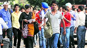 NDA aspirants come out of an examination centre in Sector 22, Chandigarh, on Sunday.