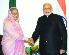 Prime Minister Narendra Modi shakes hands with his Bangladeshi counterpart Sheikh Hasina in New York