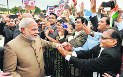 Prime Minister Narendra Modi greets Indian-Americans on his arrival at Andrews Air Force Base near Washington DC on Monday. PTI
