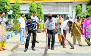 Teachers carry out a cleanliness drive at St Thomas Senior Secondary School in Ludhiana.