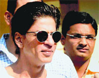 Actor Shahrukh Khan comes out of a polling station in Mumbai on Wednesday. PTI