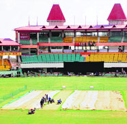 Groundsmen prepare the pitch on the eve of India-West Indies ODI in Dharamsala on Thursday.