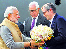 Prime Minister Narendra Modi being received by Jammu and Kashmir Governor NN Vohra (C) and Chief Minister Omar Abdullah (R) at Srinagar