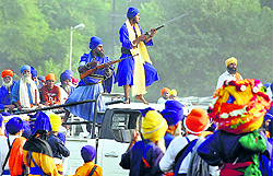 Armed supporters of a Nihang group during a clash in Amritsar on Friday
