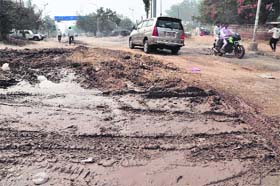 A potholed road in the Industrial Area, Phase II, Mohali