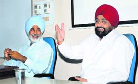 The Panjab University Registrar, Col GC Chadha (right), interacts with defence personnel at the Department of Defence and National Security Studies on the campus