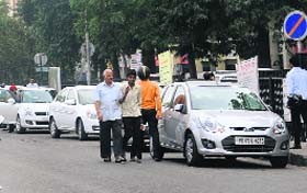 Flouting norms: Vehicles parked on the road outside the Deputy Commissioner's office at Phase I, Mohali, on Tuesday