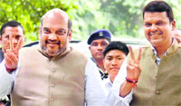 Mrashtra CM designate Devendra Fadnavis with BJP chief Amit Shah in New Delhi on Thursday. Tribune photo