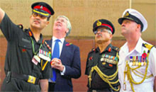 British Defence Secretary Michael Fallon (2nd from left) at the India Gate war memorial in New Delhi on Thursday. PTI