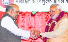 PM Narendra Modi and BJP president Amit Shah greet each other in New Delhi on Saturday.
