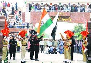 Indian and Pakistani flags being lowered at the Retreat ceremony at the Attari-Wagah joint check post on Monday.