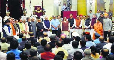 President Pranab Mukherjee and Prime Minister Narendra Modi with new ministers after the swearing-in ceremony at Rashtrapati Bhavan on Sunday