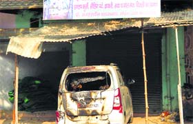 A car that was damaged in arson at Hathin, Palwal