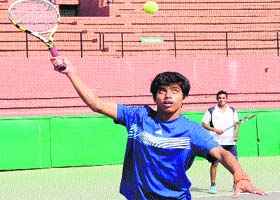 Aditya Vashisht (blue shirt) and Gurjot Singh in action during the doubles final of the CLTA-AITA championship