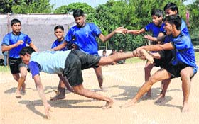 Players of Government Model School, Mani Majra, and Government Model School, Sector 11, in action during a kabaddi match in Chandigarh on Thursday