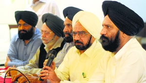 CICU president Avtar Singh addresses a press conference in Ludhiana.
