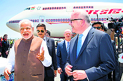 Prime Minister Narendra Modi with Australias Attorney-General George Brandis on arrival at Brisbane International Airport ahead of the G20 summit on Friday