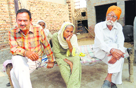 Avtar Kaur along with her son and brother-in-law at Ghagga village of Muktsar district. They are struggling to repay their huge debt.