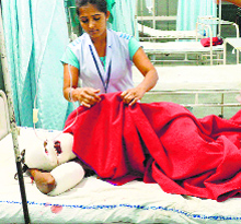 A nurse attends to an injured at a hospital in Hisar.