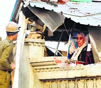 A poster of self-styled godman Rampal is seen at the damaged Satlok Ashram in Hisar
