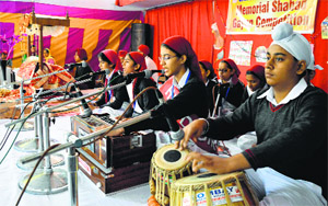 Children take part in an inter-school shabad gayan competition organised by the Sant Kartar Singh Kamalia Wale Educational Institute in Ludhiana on Thursday. GGN Public School won the first prize. The second prize went to RS Model School while the third position was grabbed by Baba Ishar Singh School.