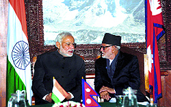Prime Minister Narendra Modi with his Nepalese counterpart Sushil Koirala during a meeting in Kathmandu on Tuesday