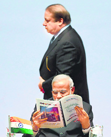 Bonhomie lost? Pakistan PM Nawaz Sharif walks past PM Narendra Modi during the SAARC summit.