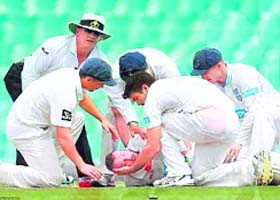 Phillip Hughes on the ground after being hit in the head by a bouncer