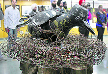An artwork catches the eyes of visitors during an exhibition in Ludhiana