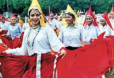 Incessant rain during the Independence day celebrations at the Parade Ground on Saturday was no damper on school girls who performed folk dances