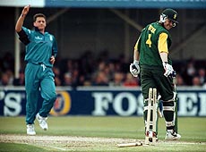 South African batsman Daryll Cullinan is bowled for 70 runs by England's Darren Gough (left) during their one-day international Emirates Triangular Tournament match at Edgbaston, Birmingham, England, on Tuesday. — AP/PTI.