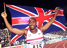 Britain's Darren Campbell holds the Union Jack, after winning the gold medal in the Men's 100-meters final at the European Track and Field Championships in Budapest on Wednesday. AP/PTI