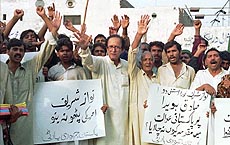Supporters of Pakistan Democrats Party raising anti-Pakistan and anti-US slogans to protest against the handing over of Mohammad Sadik Howaida to the Kenyan government, in Lahore on Wednesday. Protesters are asking the government to register a case against Howqaida in Pakistan. 