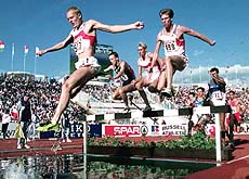 BUDAPEST, HUNGARY : Germany's Damian Kallabis, (507), leads the field over the water jump on his way to winning the gold medal in the Men's 3,000-meter steeplechase at the European Track and Field Championships in Budapest on Sunday. At right is Germany's Andre Green, centre is Germany's Marc Ostendarp and   Norway's Jim Svenoy, who took the bronze medal. AP/PTI