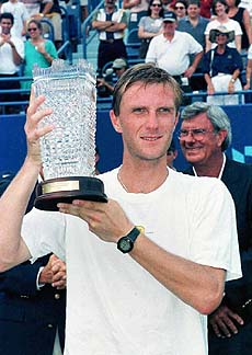 Karol Kucera, of Slovakia, poses with the winner's trophy after he defeated Goran Ivanisevic 6-4, 5-7, 6-2 to win the Pilot Pen International men's singles championship in New Haven on Sunday. This was his first tournament win in the United States. AP/PTI