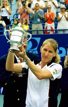 Steffi Graf of Germany holds up the U.S.T.A. hardcourt championship trophy after she won the Pilot Pen international singles championship in New Haven, Conn., on Sunday. Graf won the title by defeating Jana Novotna 6-4,6-1. — AP/PTI