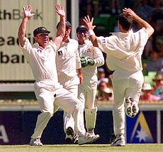 Australia's Damien Fleming (right) celebrates after taking the wicket of England Captain Alec Stewart for a duck, caught by Mark Taylor, during the second Test in Perth, Australia, on Sunday. AP/PTI