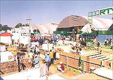 Workers giving finishing touches to pavilions for Agro Tech- 98