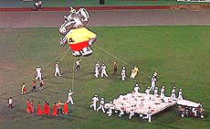 BANGKOK : "Chai Yo" the 13th Asian Games mascot is pulled along by a Bangkok Tuk-tuk as he enters the Hua Mark Sports Complex on Tuesday, during a dress rehearsal for opening ceremonies. Opening Ceremoneis for the games are set for Dec. 6, 1998 — AP/PTI