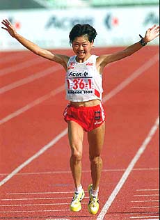 Japan's Naoko Takahashi crosses the finish line.