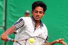 BANGKOK : India's Prahlad Srinath returns service during first round tennis competition against Al-Alawi Sultan Khalfan of Qatar on Tuesday at 13th Asian Games in Bangkok. Prahlad defeated Khalfan 6-1, 6-2. AP/PTI