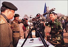 The Bangladesh Army Chief, Lieut-Gen Muhammad Mustafiz-ur-Rahman, inspects a medium mechinegun at the Kharga stadium in Ambala on Wednesday — Tribune photo by Pankaj Sharma